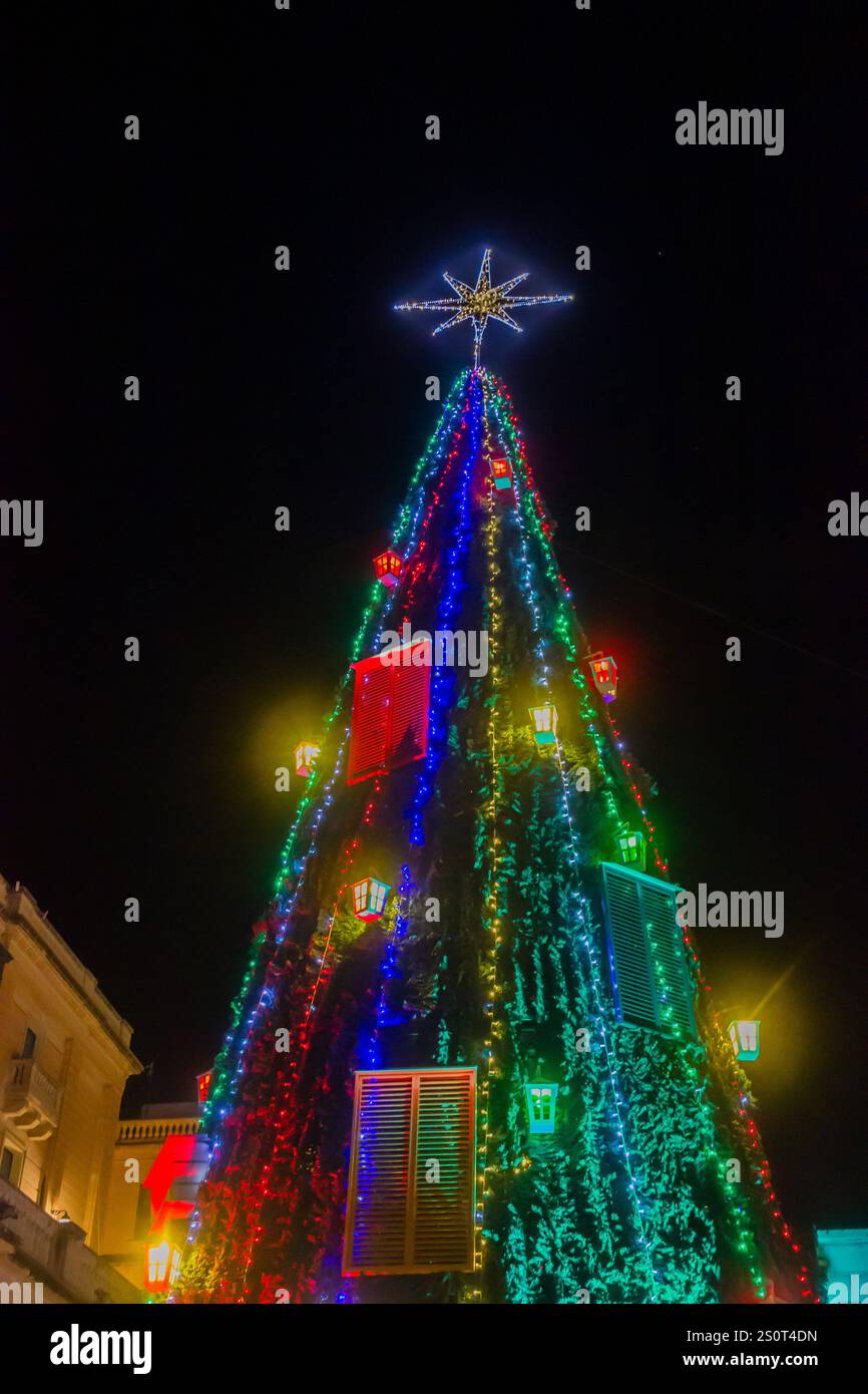 Vibrant Christmas Tree Illuminated With Bold Lights and Colorful ...