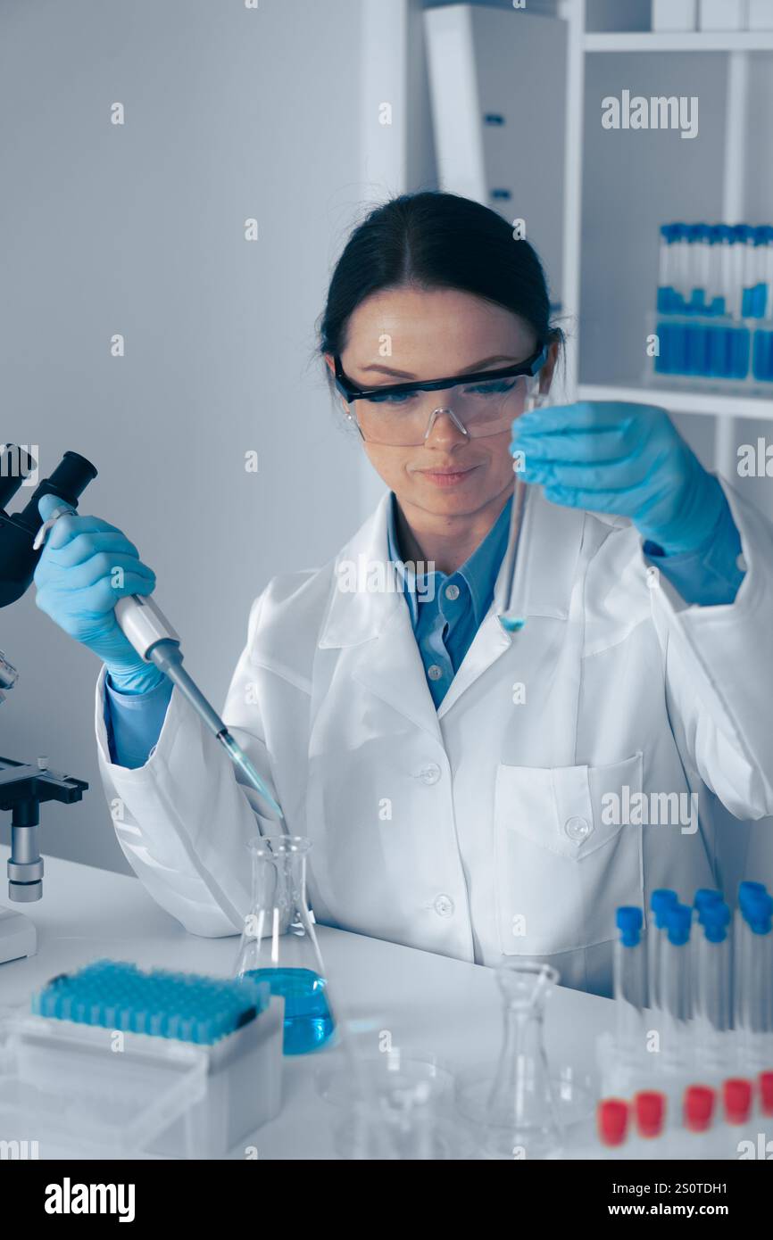 A skilled female scientist is conducting a complex experiment with a ...