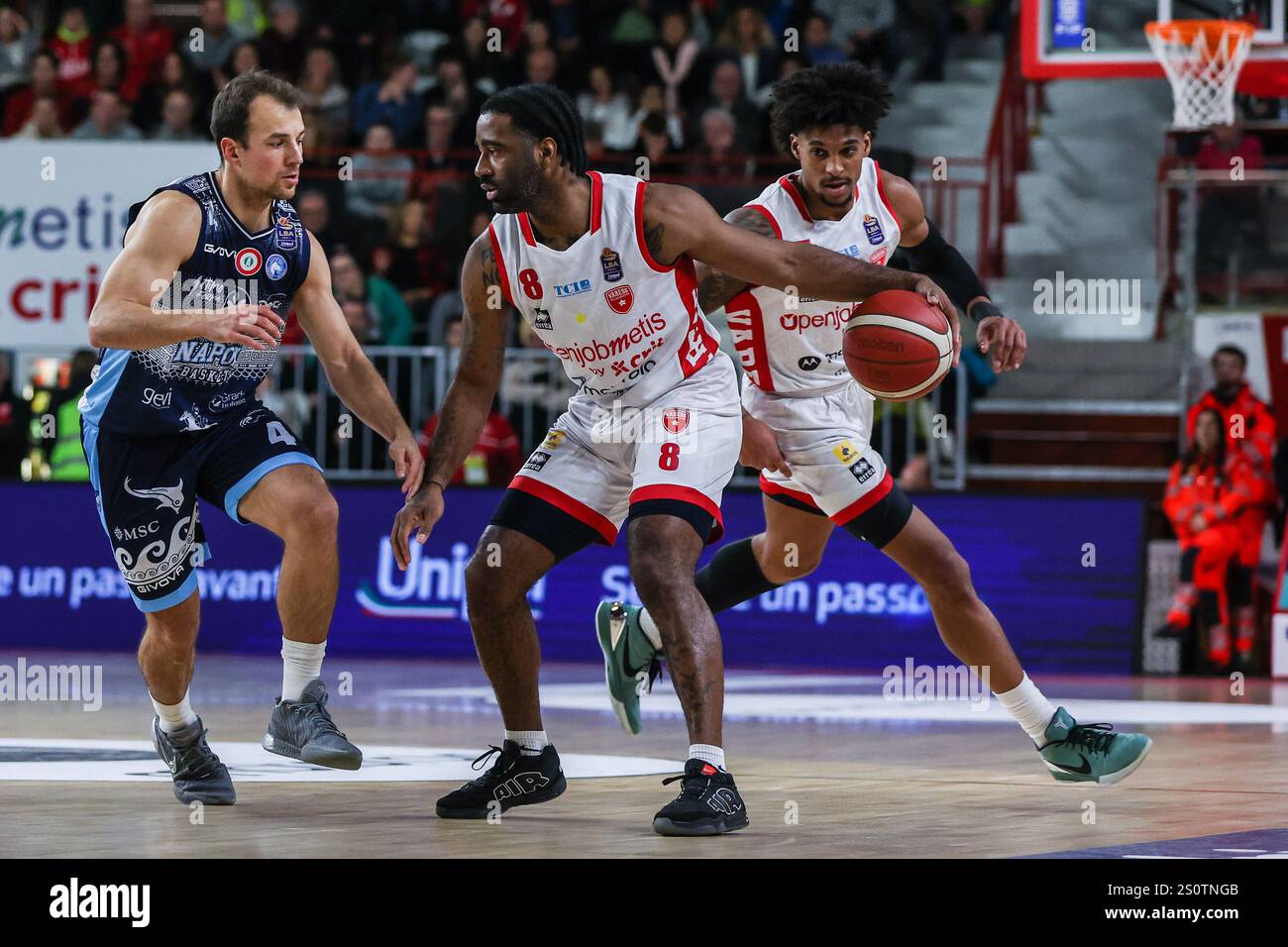 Varese, Italy. 28th Dec, 2024. (C) Desonta Bradford #8 of Pallacanestro Varese OpenJobMetis seen in action with (L) Kevin Pangos of Napoli Basket and (R) Justin Gray #5 of Pallacanestro Varese OpenJobMetis during LBA Lega Basket A 2024/25 Regular Season game between Pallacanestro Varese OpenJobMetis and Napoli Basket at Itelyum Arena. Final score Pallacanestro Varese OpenJobMetis 89 : 86 Napoli Basket (Photo by Fabrizio Carabelli/SOPA Images/Sipa USA) Credit: Sipa USA/Alamy Live News Stock Photo