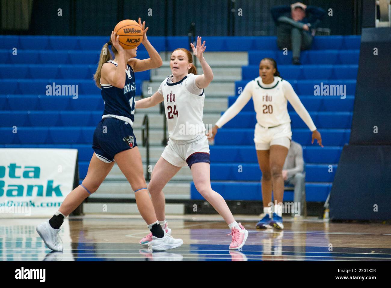 Hackensack, USA. 28th Dec, 2024. Kailee McDonald (24) defends during ...