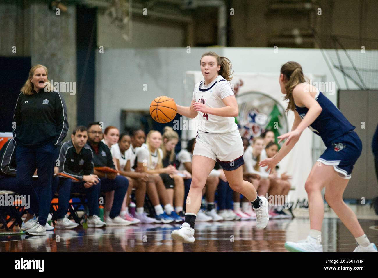 fdu-head-coach-stephanie-gaitley-looks-on-as-ava-renninger-4-handles