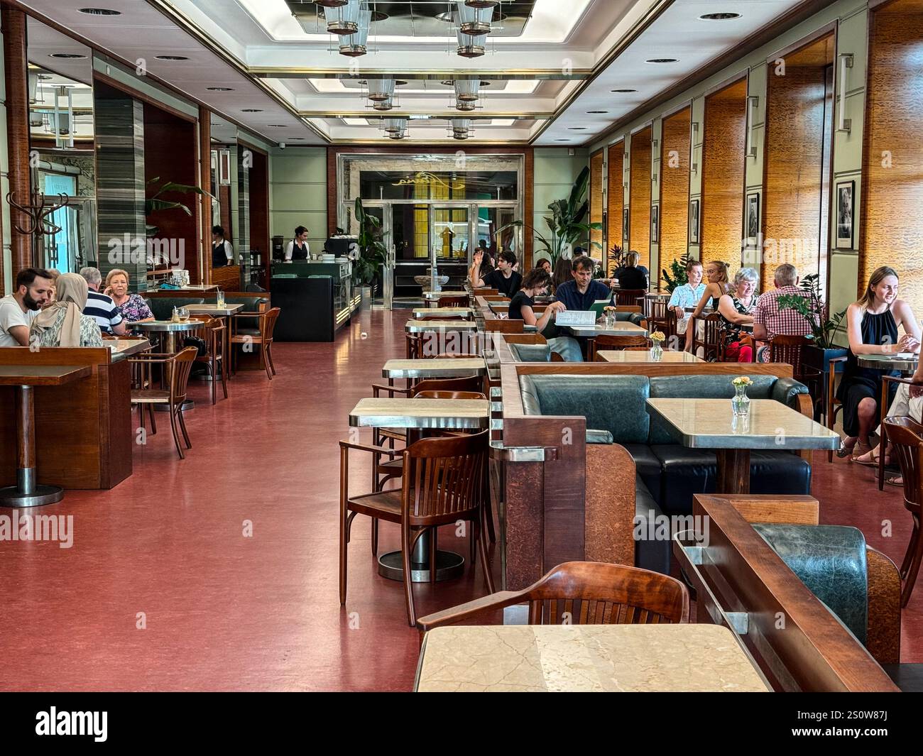Patrons in the Kavarna Slavia, Cafe Slavia, Prague, Czech Republic, Czechia. Art Nouveau Decor. Stock Photo