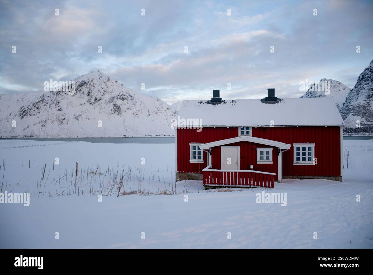 Wonderful winter view on red and white buildings, and cloudy sky ...