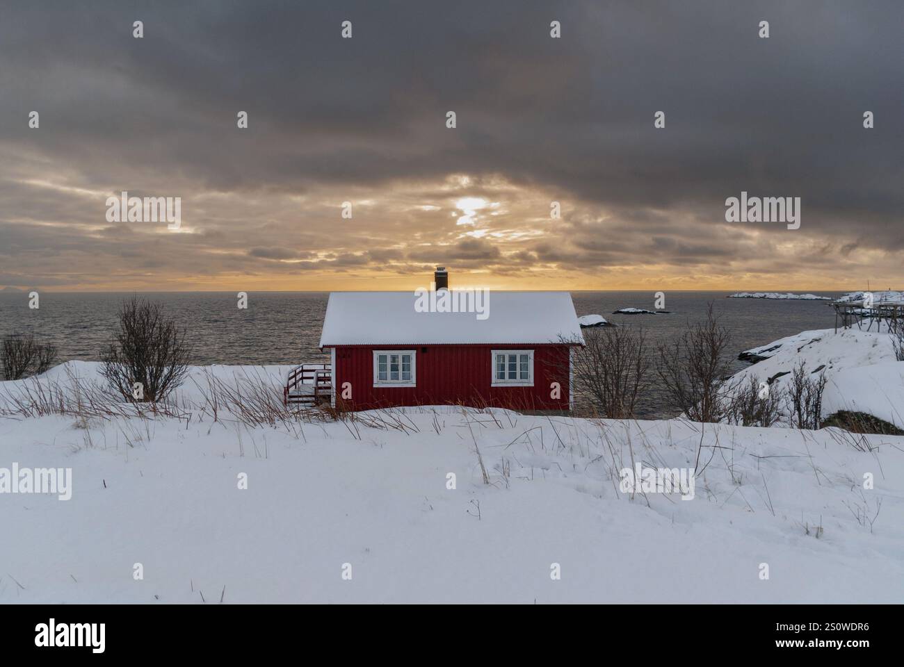 Wonderful winter view of red and white buildings, and cloudy sky ...