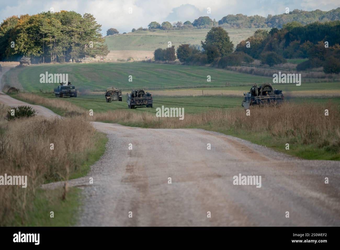 a squadron of British army FV4034 Challenger 2 ii main battle tanks and IFV FV510 Warriors on a military combat exercise Stock Photo