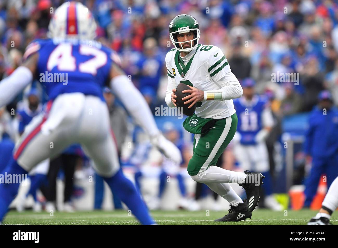 New York Jets quarterback Aaron Rodgers (8) looks to pass against the