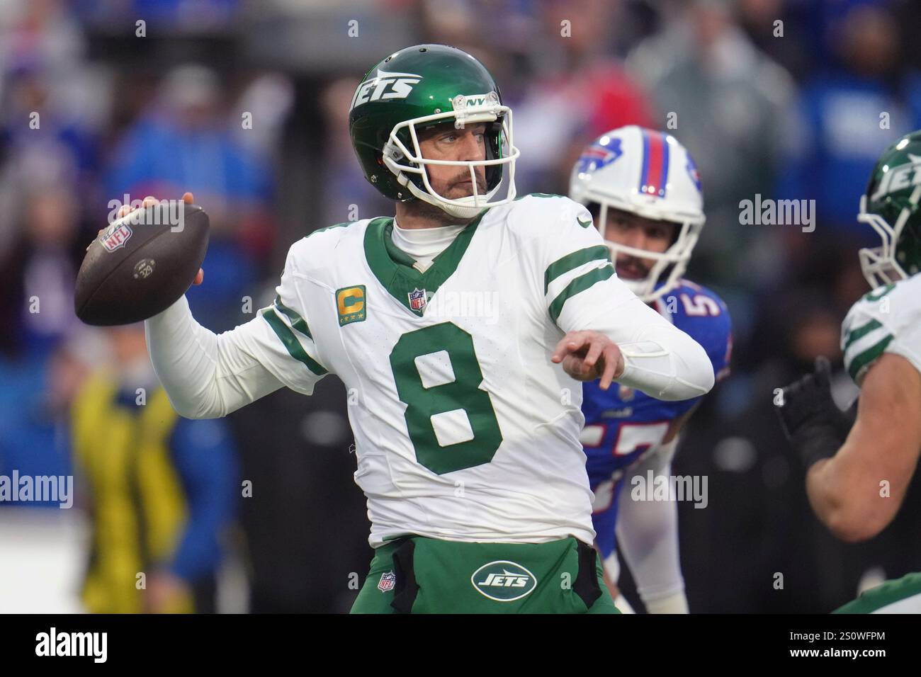 New York Jets quarterback Aaron Rodgers (8) looks to pass against the