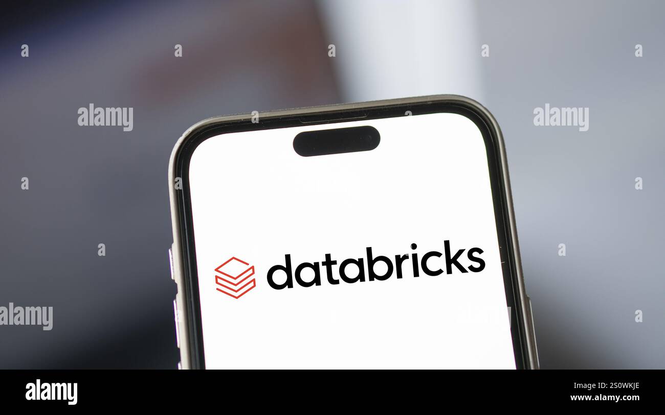 Databricks logo is displayed on smartphone. Databricks Inc is a global data, analytics and artificial intelligence (AI) company. Stock Photo