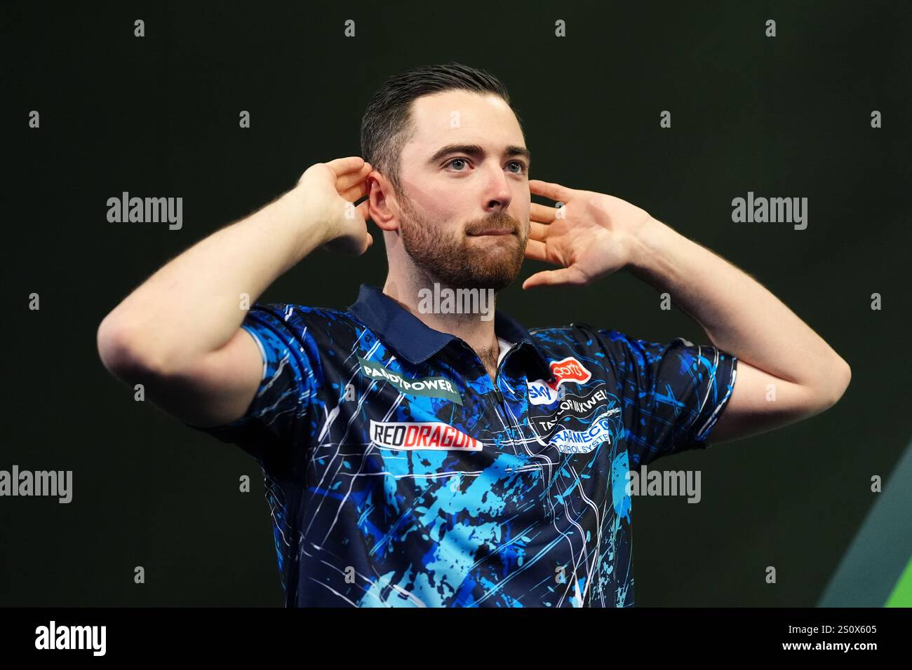Luke Humphries walks out to play Peter Wright (not pictured) on day
