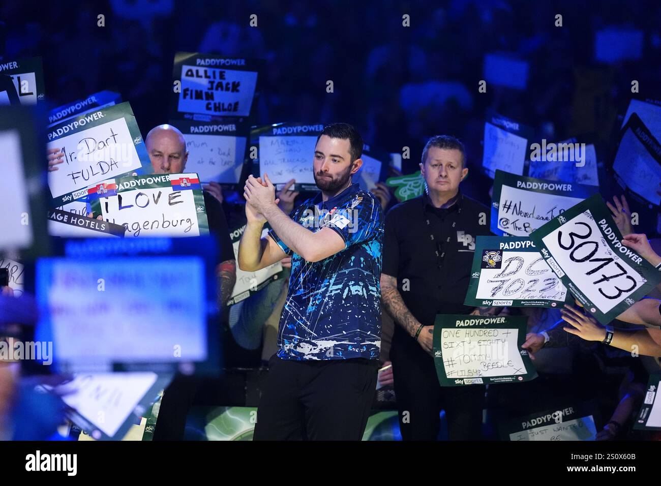 Luke Humphries walks out to play Peter Wright (not pictured) on day