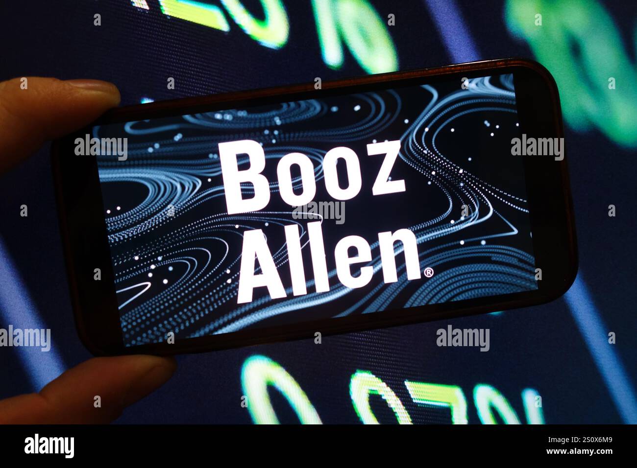 In this photo illustration, the Booz Allen Hamilton company logo is