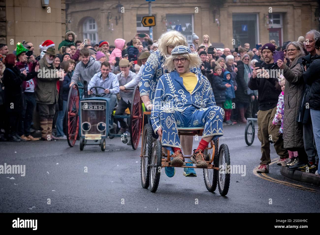 Pram Racing Boxing Day Pram Race in Crewkerne. Hundreds of locals line the streets ...