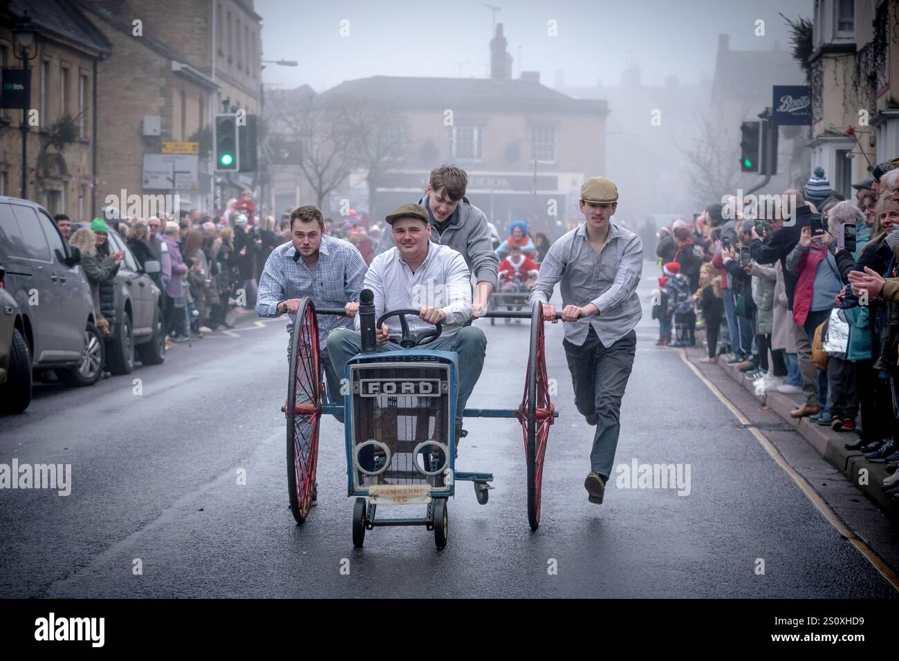Pram Racing Boxing Day Pram Race in Crewkerne. Hundreds of locals line the streets ...