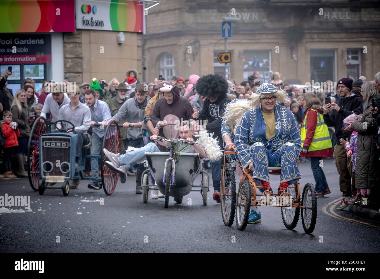 Pram Racing Boxing Day Pram Race in Crewkerne. Hundreds of locals line the streets ...