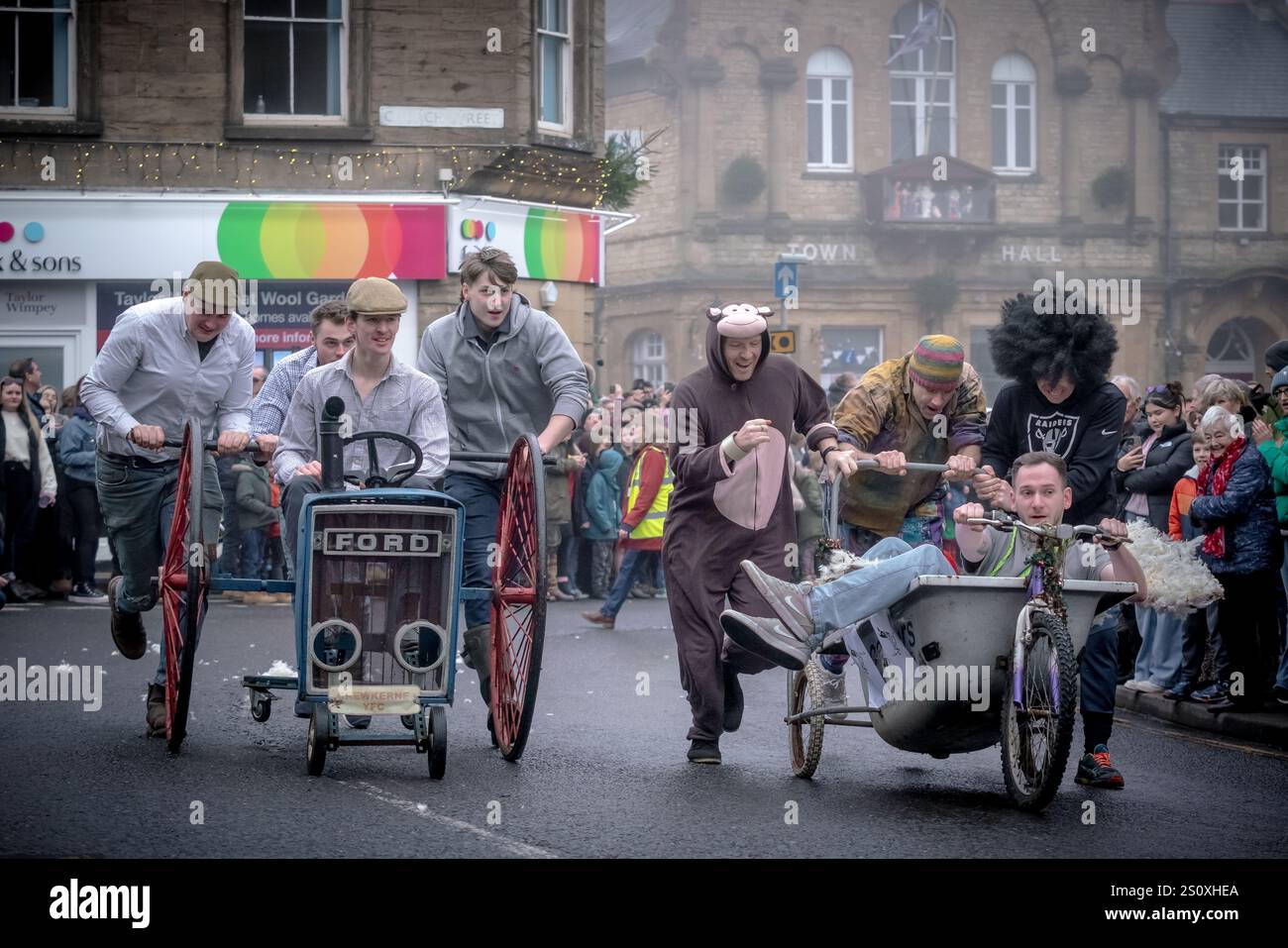 Pram Racing Boxing Day Pram Race in Crewkerne. Hundreds of locals line the streets ...