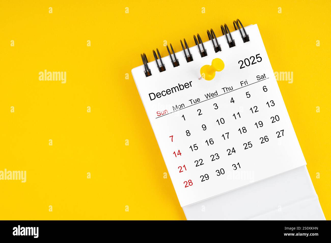 December 2025 Monthly desk calendar for 2025 year with thumbtack on