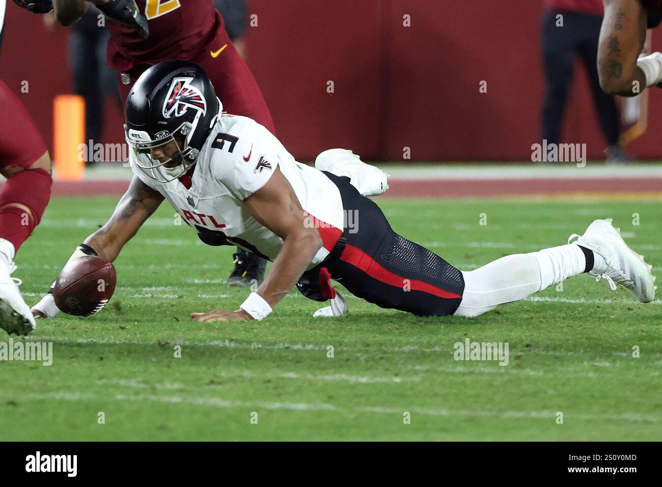 Atlanta Falcons quarterback Michael Penix Jr. (9) dives on a fumble