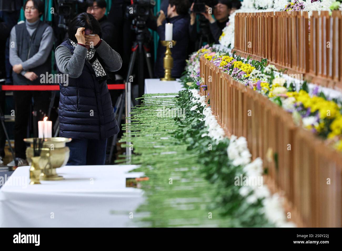 Plane fire in Maun, South Korea Bereaved family members pay tribute at