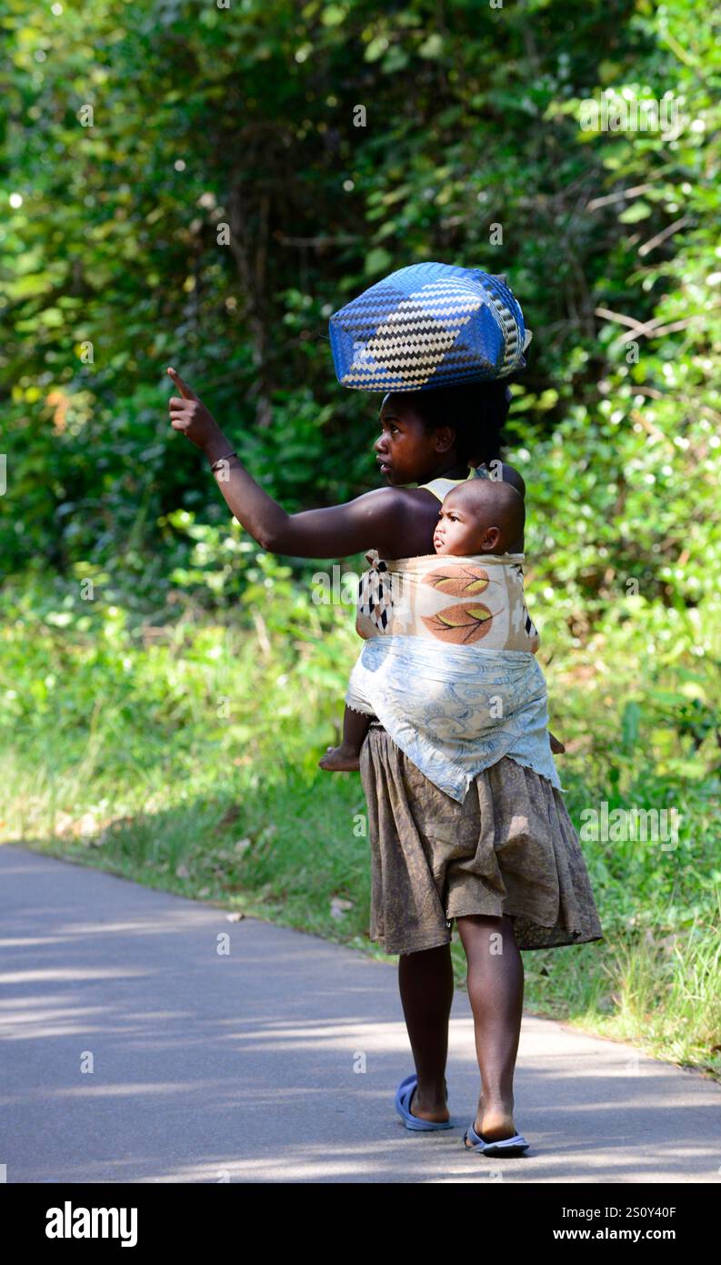 Indian woman carrying baby hi-res stock photography and images - Alamy