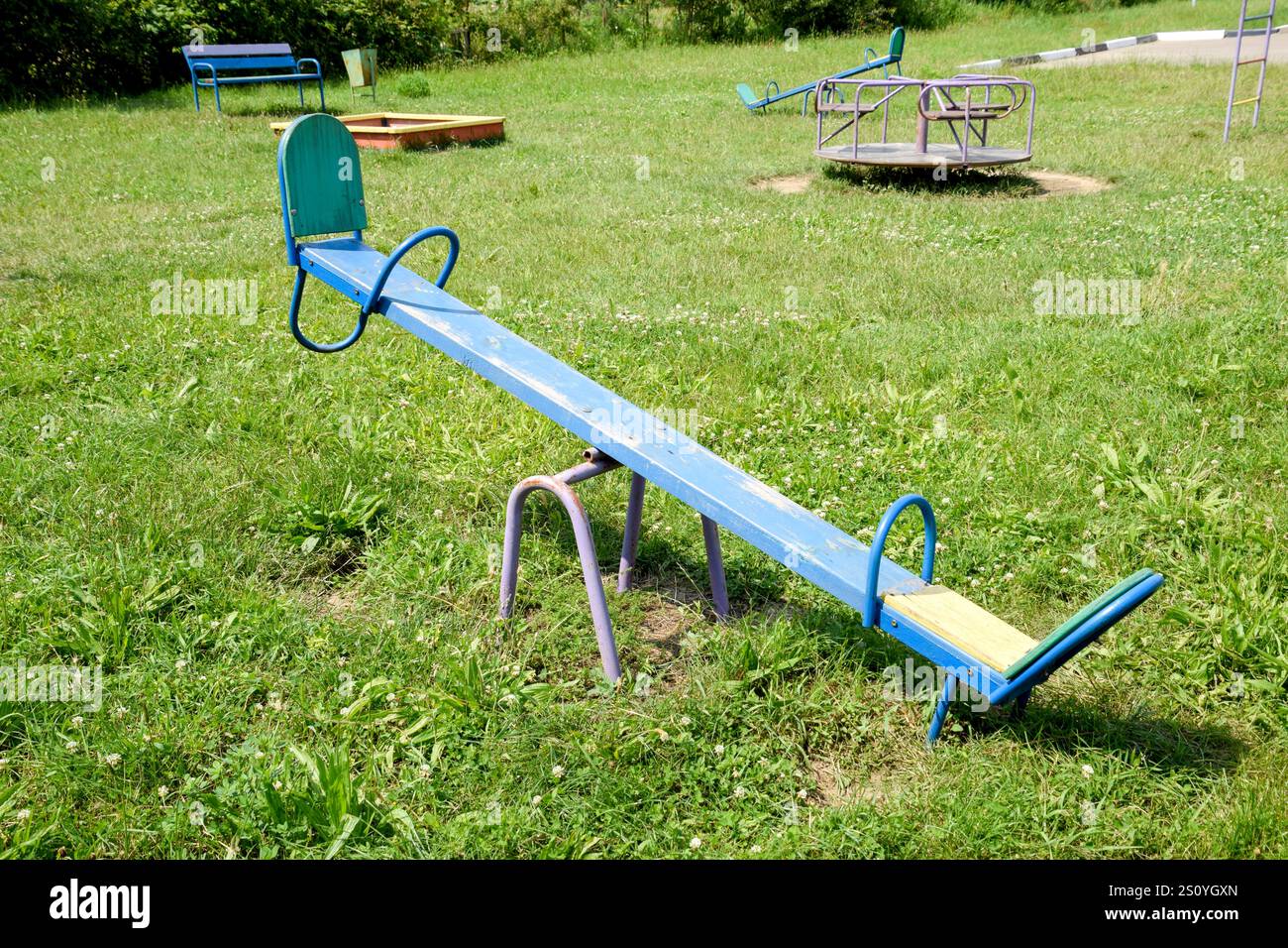 Children's rocking chair on the playground Stock Photo - Alamy