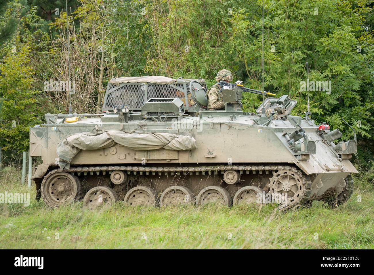 Fv432 soldier commanding a british army Bulldog FV432 tank in action on a ...