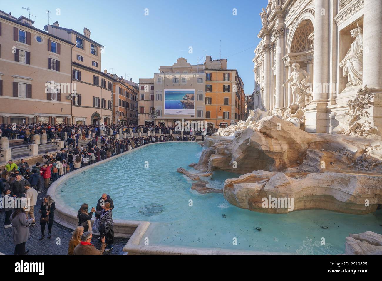 Rome, Italy. 30 December 2024 Large crowds gather at the Trevi fountain ...