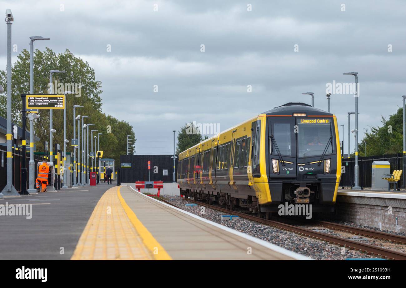 Merseyrail class 777 battery electric multiple unit 777150 at  Headbolt Lane railway station, while running on battery power Stock Photo