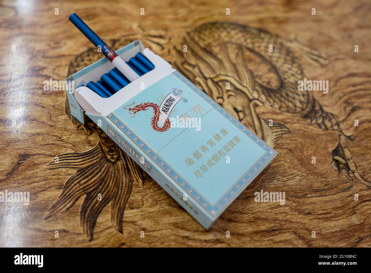 China Yantai 2015 06 11 Dragon Wood Table Cigarettes Packet Blue China Yantai 2015 06 11 Dragon Wood Table Cigarettes Packet Blue