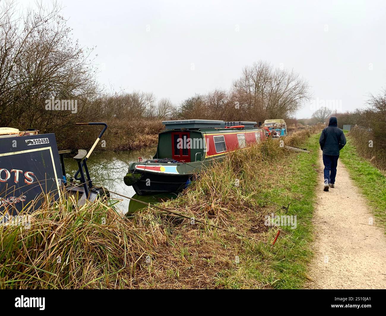 Northampton Northamptonshire boat water canal people place man walk walking countryside amble cold winter weather path track ship narrow boat - Smartphone Captured Stock Image