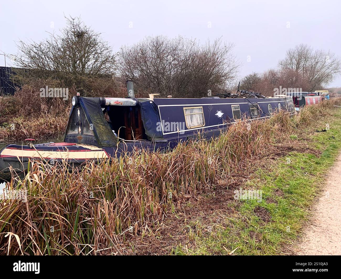 Northampton Northamptonshire boat water canal people place man walk walking countryside amble cold winter weather path track ship narrow boat - Smartphone Captured Stock Image