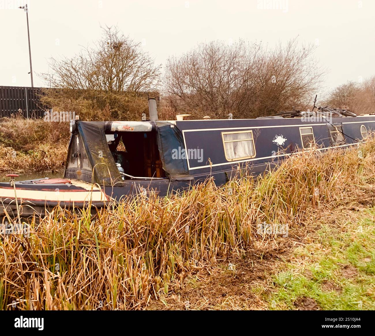 Northampton Northamptonshire boat water canal people place man walk walking countryside amble cold winter weather path track ship narrow boat - Smartphone Captured Stock Image