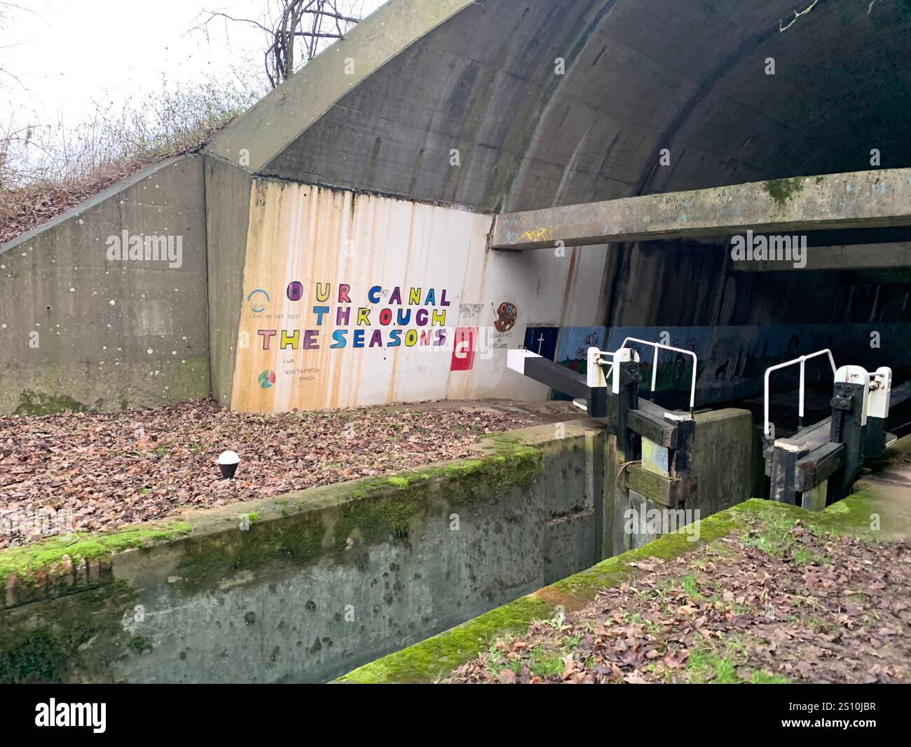 Northampton Northamptonshire boat water canal people place man walk walking countryside amble cold winter weather path track ship narrow boat - Smartphone Captured Stock Image