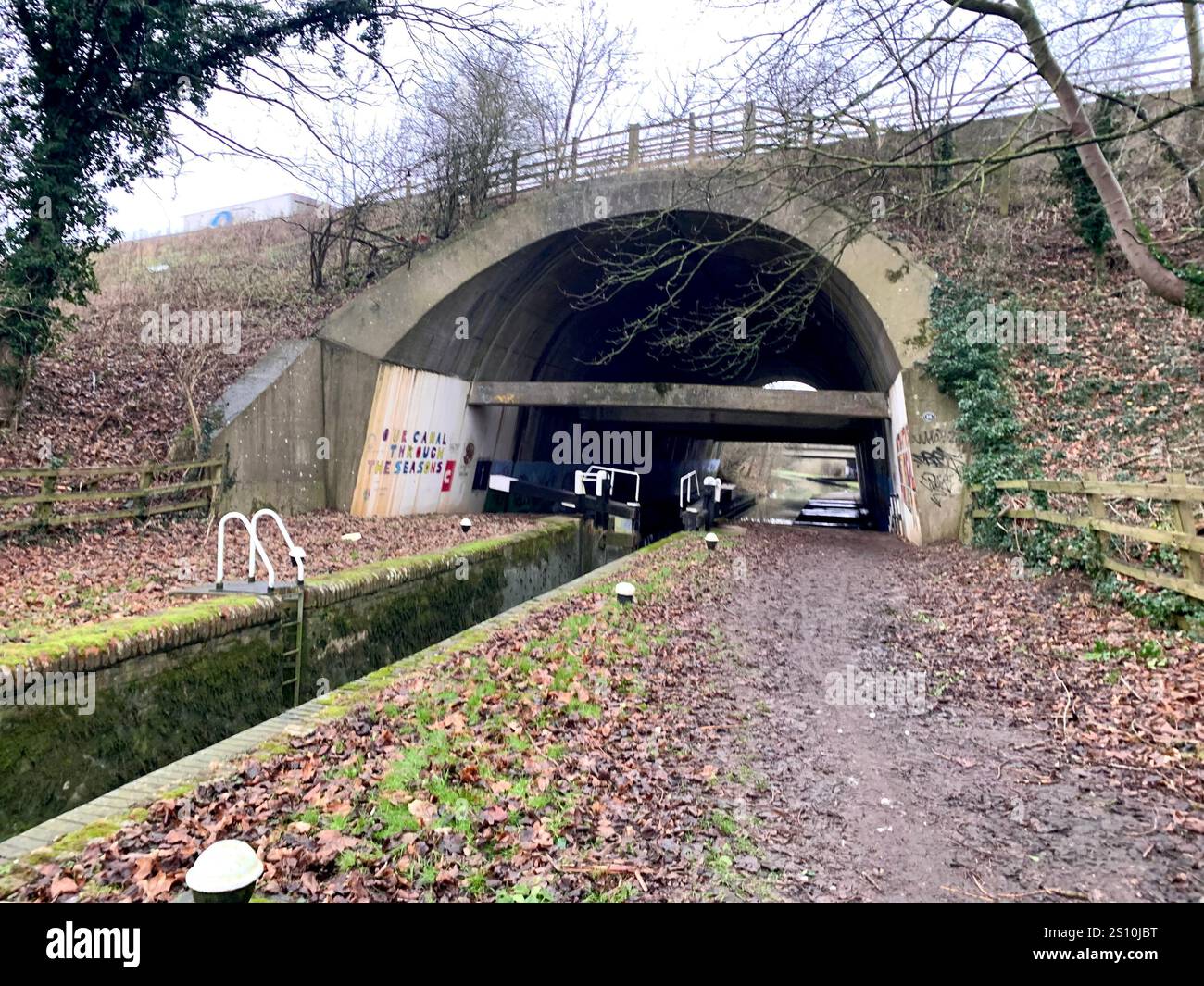 Northampton Northamptonshire boat water canal people place man walk walking countryside amble cold winter weather path track ship narrow boat - Smartphone Captured Stock Image
