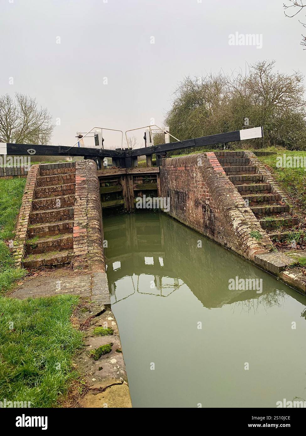 Northampton Northamptonshire boat water canal people place man walk walking countryside amble cold winter weather path track ship narrow boat - Smartphone Captured Stock Image