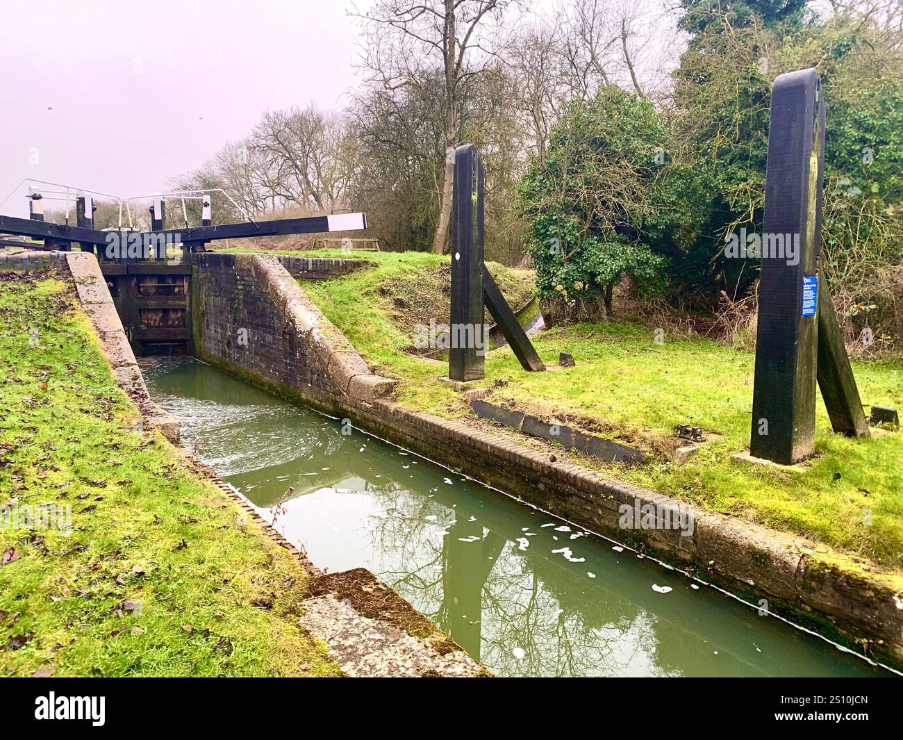 Northampton Northamptonshire boat water canal people place man walk walking countryside amble cold winter weather path track ship narrow boat - Smartphone Captured Stock Image