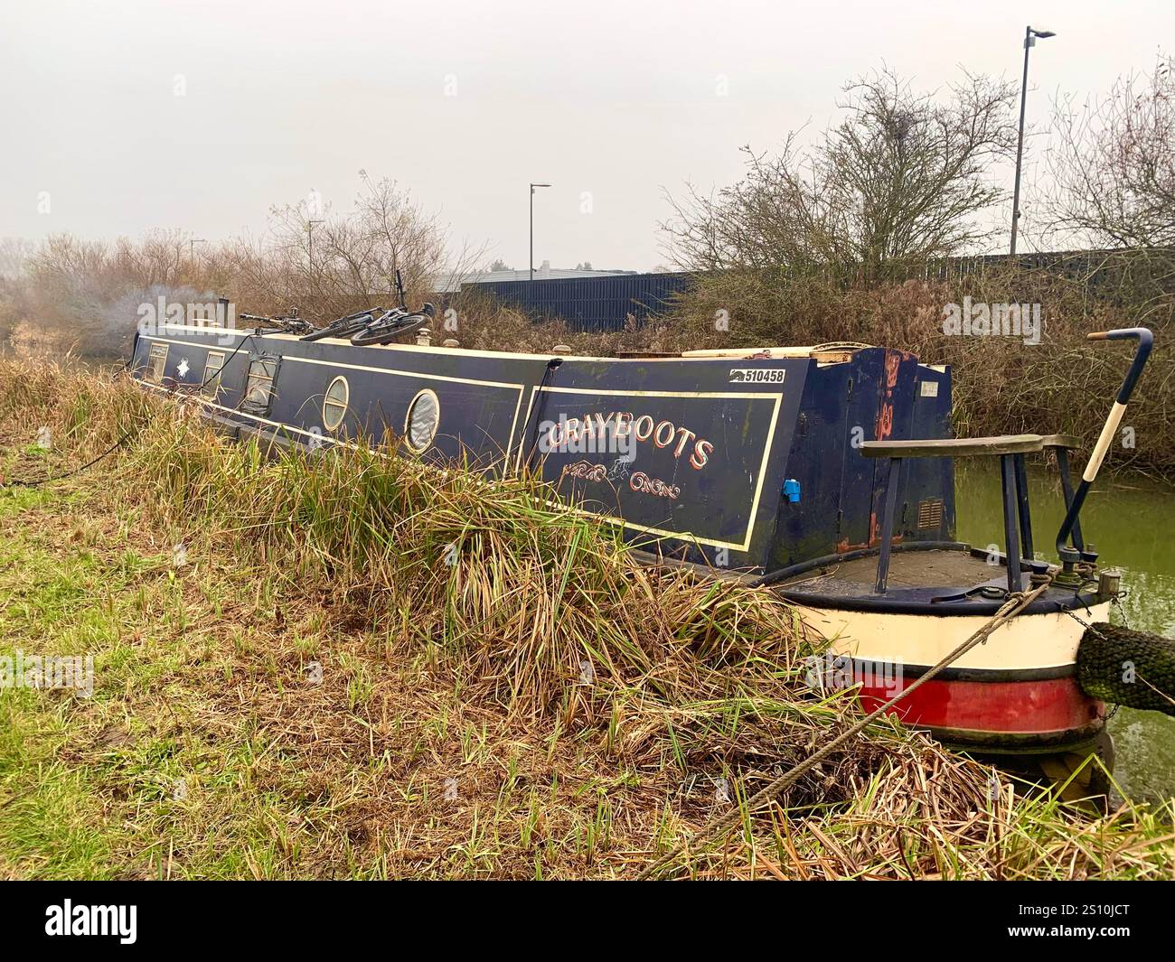 Northampton Northamptonshire boat water canal people place man walk walking countryside amble cold winter weather path track ship narrow boat - Smartphone Captured Stock Image