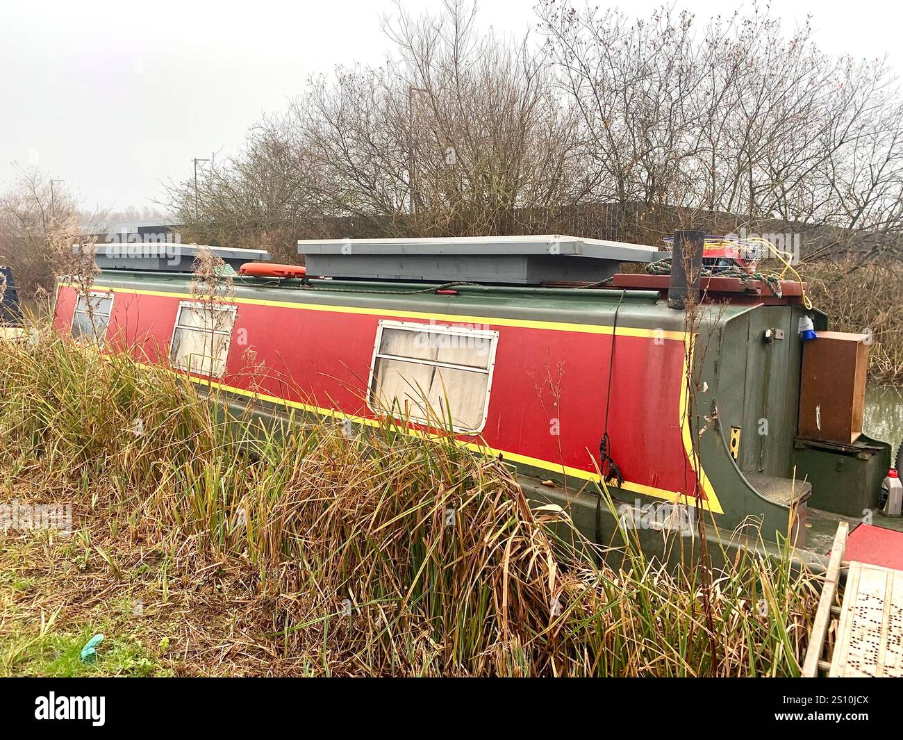 Northampton Northamptonshire boat water canal people place man walk walking countryside amble cold winter weather path track ship narrow boat - Smartphone Captured Stock Image