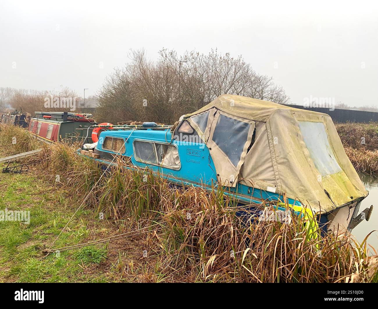 Northampton Northamptonshire boat water canal people place man walk walking countryside amble cold winter weather path track ship narrow boat - Smartphone Captured Stock Image