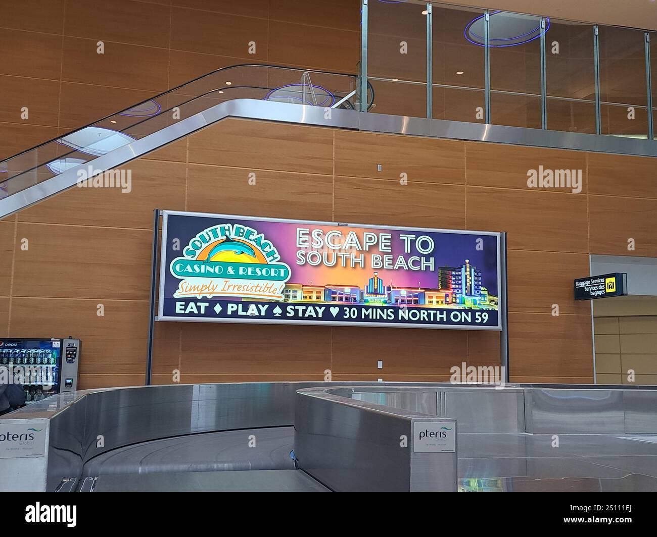 Escape to South Beach Casino & Resort sign inside Winnipeg International Airport in Winnipeg, Manitoba, Canada Stock Photo
