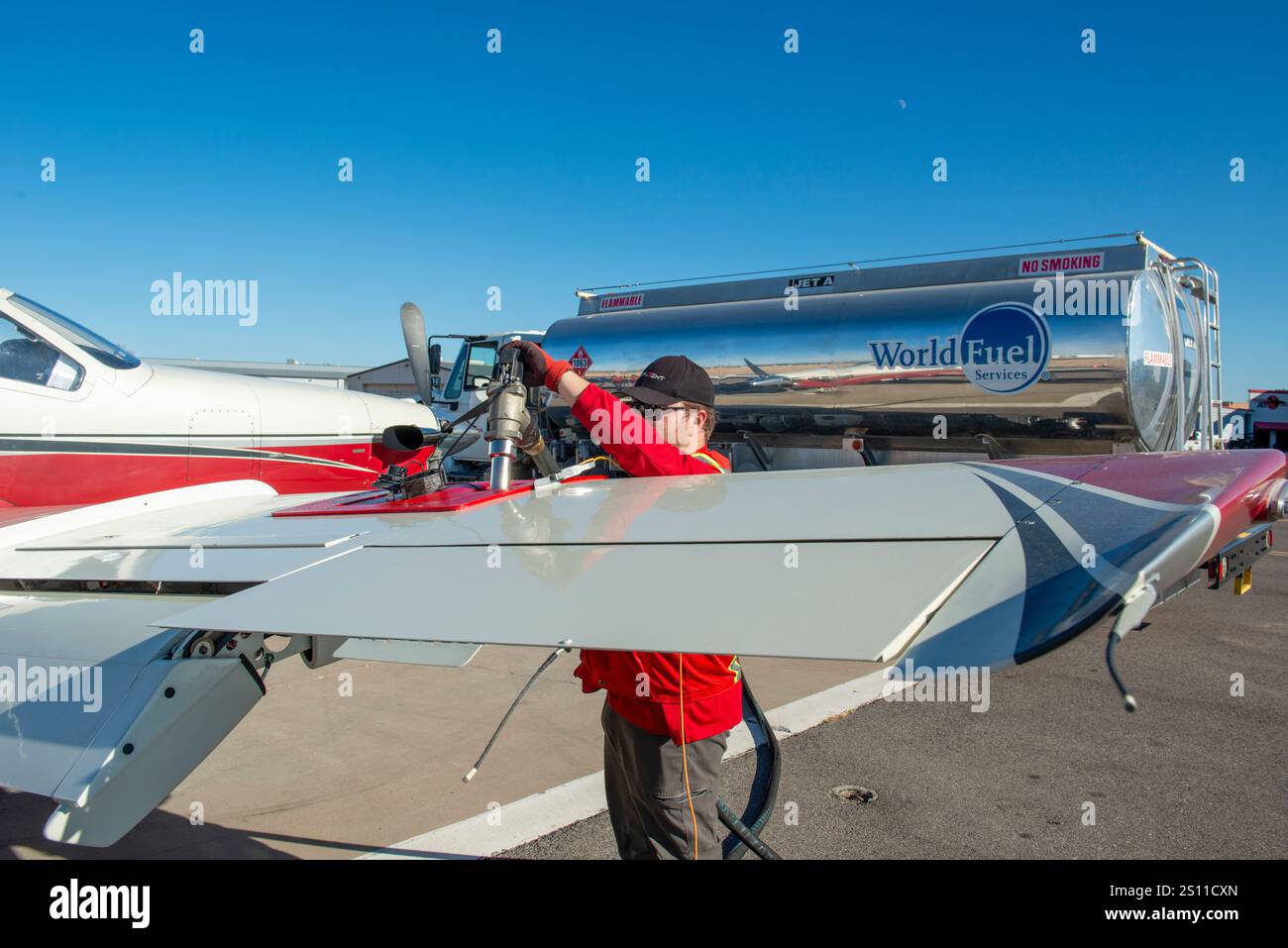 Man refueling a small private aircraft at an airport in Arizona Stock ...