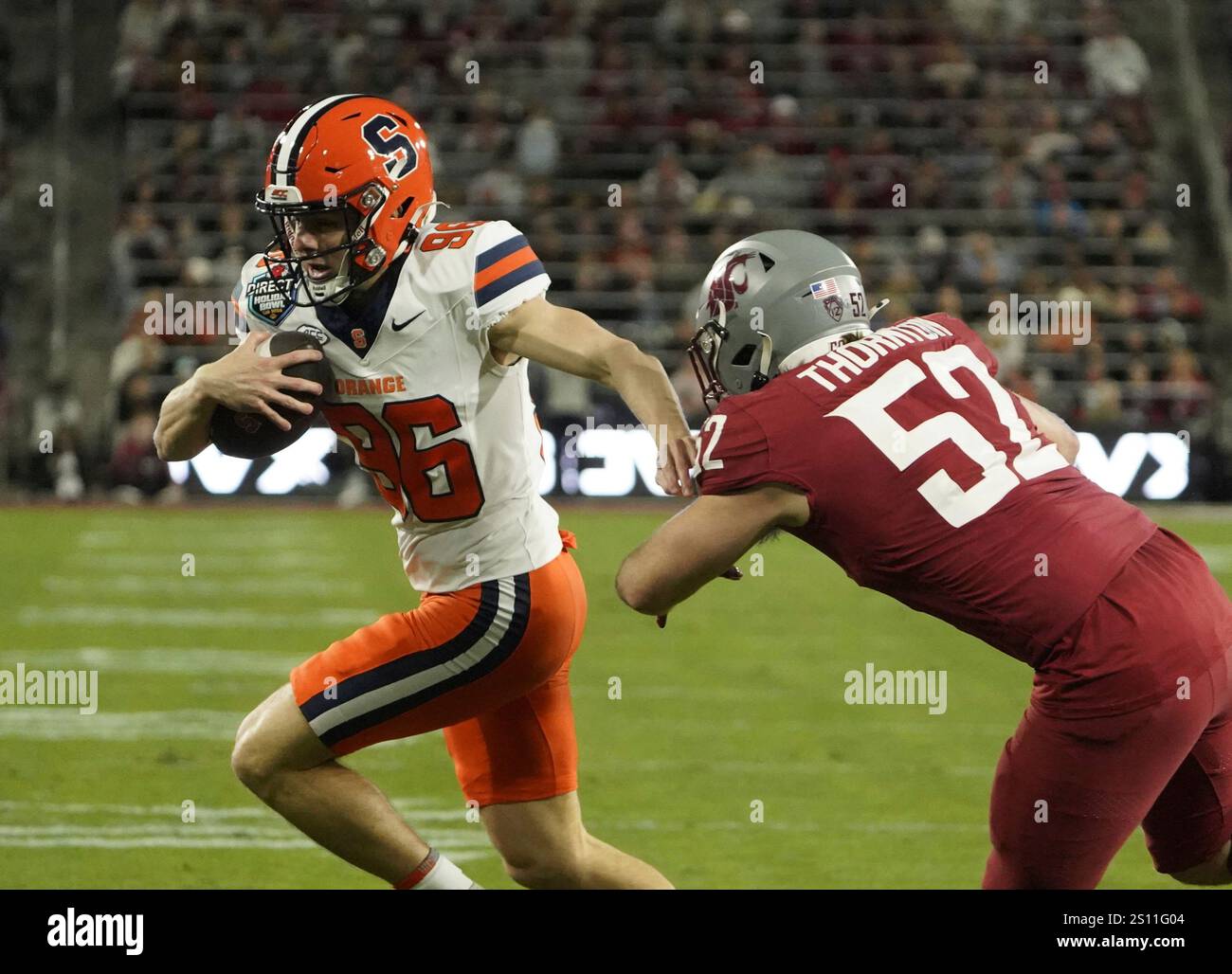 Syracuse kicker Jackson Kennedy (96) runs the football during the