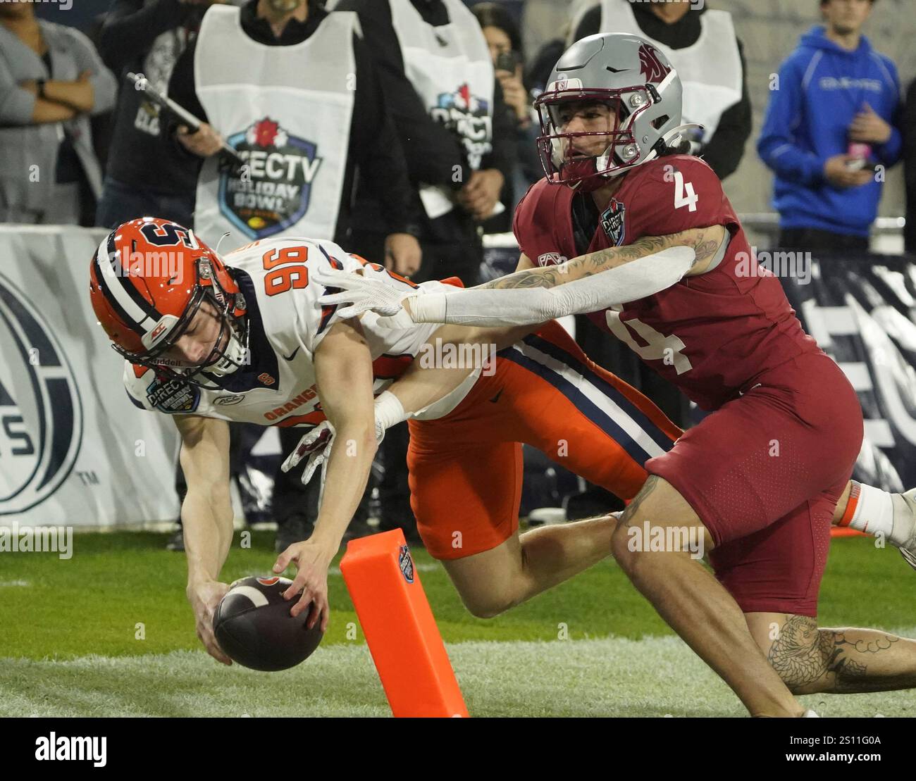 Syracuse kicker Jackson Kennedy (96) runs the football during the