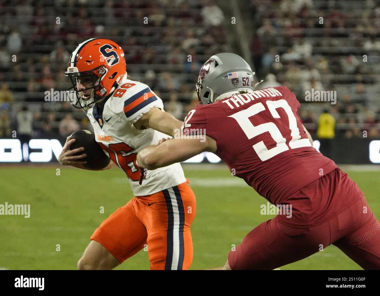 Syracuse kicker Jackson Kennedy (96) runs the football during the