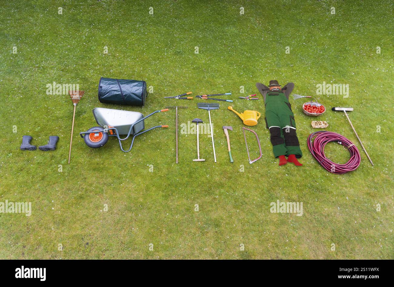 Garden tools spread out on a lawn Stock Photo