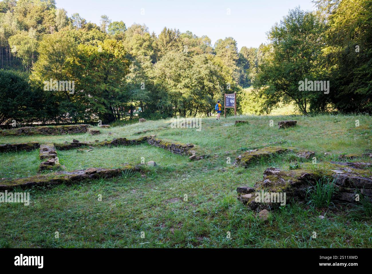 Roman remains  with person reading information sign, Chameleux, Belgium Stock Photo