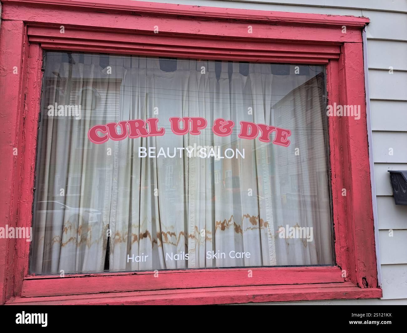 Curl Up & Dye beauty salon sign on Gower Street in downtown St. John's, Newfoundland & Labrador, Canada Stock Photo