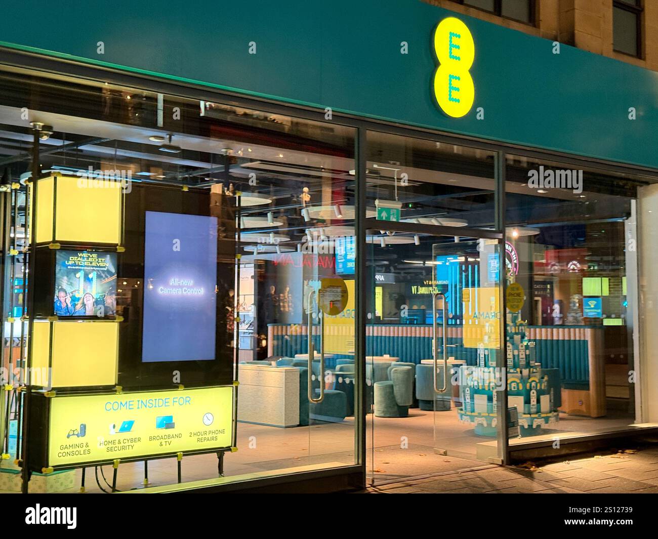 Cardiff, Wales - 8 November 2024: Front exterior view of the branch of the EE Mobile Phone company in Cardiff city centre - Smartphone Captured Stock Image Cardiff, Wales - 8 November 2024: Front exterior view of the branch of the EE Mobile Phone company in Cardiff city centre - Smartphone Captured Stock Image