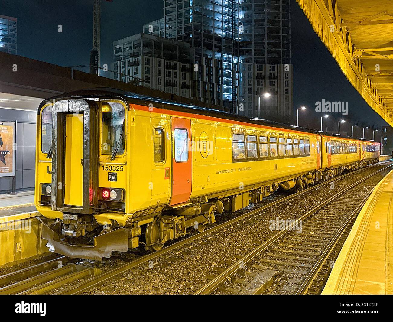 Cardiff, Wales, UK - 17 November 2024: Diesel commuter train operated by Transport for Wales  stopped at Cardiff Central railway station at night - Smartphone Captured Stock Image