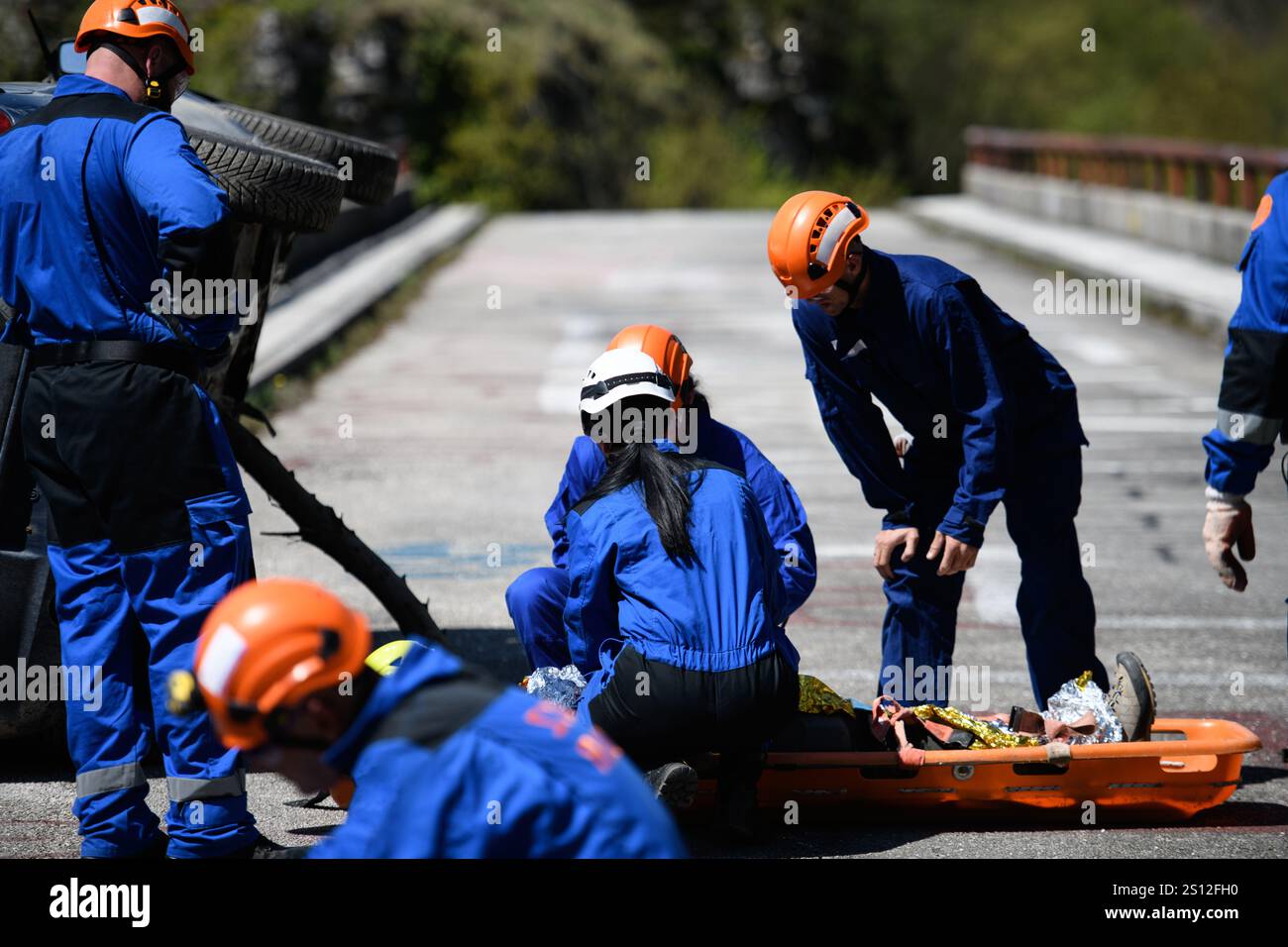 Medical responder checking injured person after being rescued from ...
