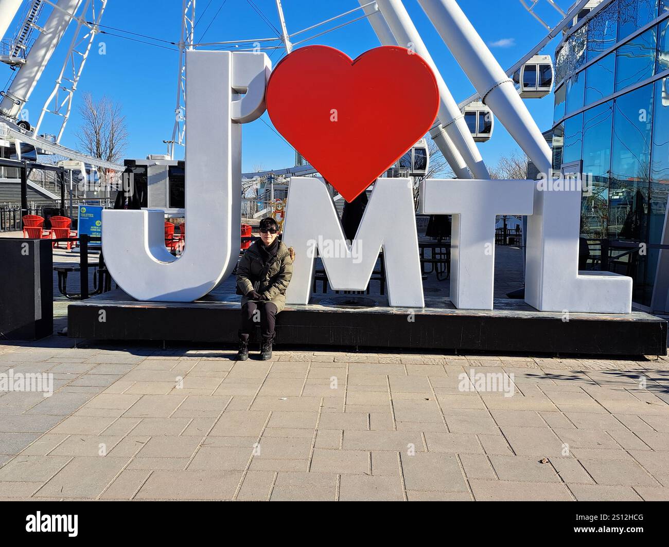 I heart MTL sign beside La Grande Roue ferris wheel in vieux Montreal ...
